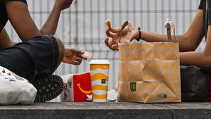 Why are some French cities banning fast-food outlets?